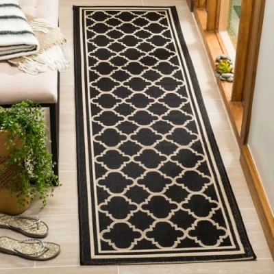 Obrázek SAFAVIEH Mřížovitý koberec pro vnitřní i venkovní použití Courtyard Collection, krátký vlas, černý a béžový, 69 x 244 cm